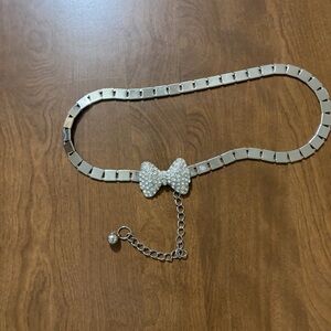 Silvertone rhinestone bow belt
